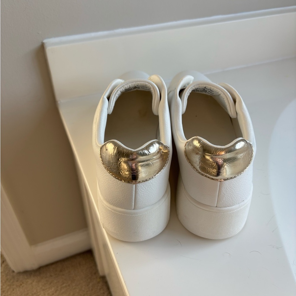 Platform sneakers. 

Never worn ….gorgeous platform sneakers